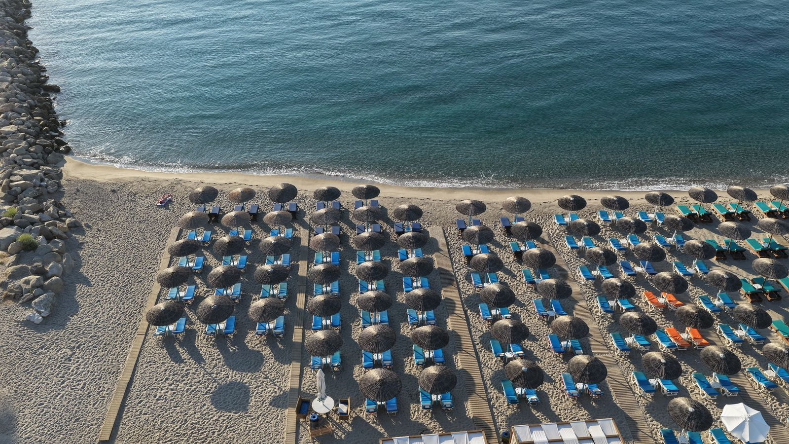 Rows of umbrellas and sunbeds on Kardamena beach